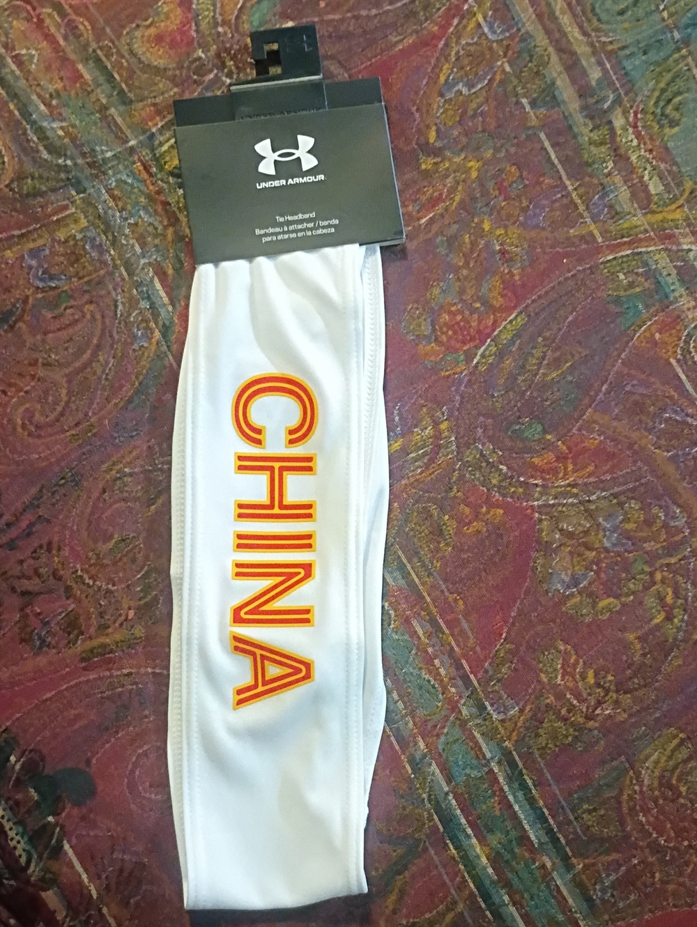 Under Armour White Athletic Headband with Red-Orange China Lettering